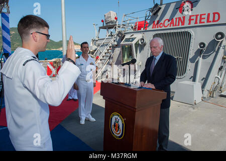 170602-N-XK398-049 CAM RANH INTERNATIONAL PORT, Vietnam (Jun. 02, 2017) Senator John S. McCain III reenlists the ship’s sailor of the year Electronics Technician 2nd Class Michael Papapietro during a visit to the Arleigh Burke-class guided-missile destroyer USS John S. McCain (DDG 56). The U.S. Navy has patrolled the Indo-Asia-Pacific routinely for more than 70 years promoting regional peace and security. (U.S. Navy photo by Mass Communication Specialist 3rd Class Joshua Mortensen/Released) Senator McCain Visits USS John S. McCain in Vietnam by #PACOM Stock Photo