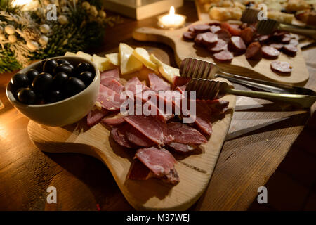 Food buffet with olives, cheese, ham and chourizo platters Stock Photo