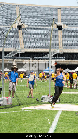 U.S. Air Force Maj. Stacie Shafran, a public affairs officer from Denver Colo., throws a discus during a standing shot put event at the 2017 Warrior Games Soldier Field, Chicago, Ill., July 5, 2017. Approximately 265 seriously wounded, ill and injured service members and veterans will participate in this year’s competition, representing the Army, Marine Corps, Navy, Coast Guard, Air Force and U.S. Special Operations Command. Shafran would go on to win the silver medal in her category. (U.S. Air Force photo by Staff Sgt. Keith James) 170705-F-GV347-0211 by Air Force Wounded Warrior Stock Photo