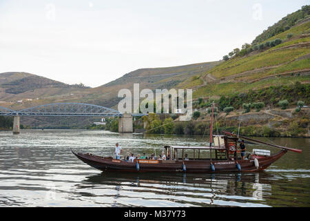 Rabelo boats traditionally used to transport Port wine on the river Douro converted into a tour boat for tourists in Pinhão, Portugal, Europe Stock Photo