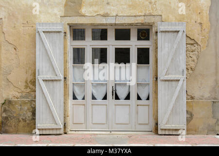 Window with white wooden shutters in Labastide-d'Armagnac, Landes Department, Nouvelle-Aquitaine, Southwest France Stock Photo