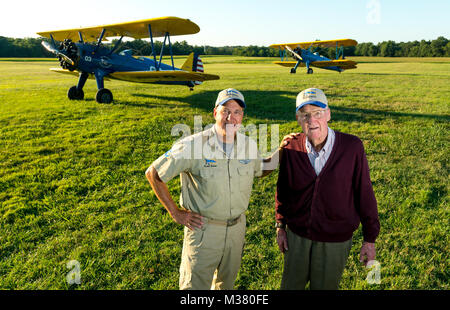 Al Tucker Jr., 96,  and First Sgt. Dave Brown, U.S. Air Force Reserve, talk after Tucker took off, flew and landed Brown's PT-17 Stearman biplane multiple times at the Flying Circus Aerodrome in Bealeton, Va., Jul. 30, 2017. Brown's PT-17 is the same model in which Tucker trained at West Point in 1942 before going on to fly P-38 fighter aircraft over Europe with the U.S. Army Air Corps 434th Fighter Squadron during WWII with his friend, then Lt., Robin Olds. The two have been flying together for nearly 10 years. (U.S. Air Force photo by J.M. Eddins Jr.) 20170730-F-LW859-029 by AirmanMagazine Stock Photo