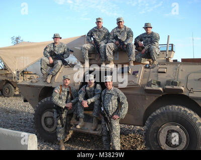 Soldiers from the 1041st Engineer Company during a pause in missions in Iraq, 2006-07. Left to right, top row -  Cal Neald, Chris McGuire, Rodolfo Delagarza Jr., Christopher Starks. Bottom row - Eugene Gosselin Jr., Mike McGee, Jason Spaulding. Courtesy photo 170907-Z-XXXXX-0001 by wyoguard Stock Photo