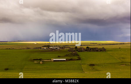 Beachy Head, East Sussex, UK. 8th February 2018. A snow and hail storm passes across the South Downs at Beachy Head before continuing out to sea. Stock Photo