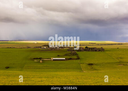 Beachy Head, East Sussex, UK. 8th February 2018. A snow and hail storm passes across the South Downs at Beachy Head before continuing out to sea. Stock Photo