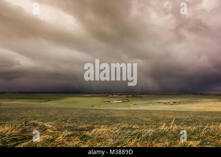 Beachy Head, East Sussex, UK. 8th February 2018. A snow and hail storm passes across the South Downs at Beachy Head before continuing out to sea. Stock Photo