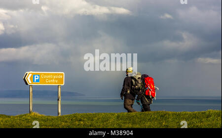 Beachy Head, East Sussex, UK. 8th February 2018. A snow and hail storm passes across the South Downs at Beachy Head before continuing out to sea. Stock Photo