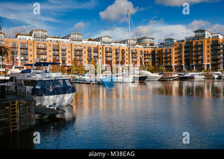 Popular housing and leisure complex with yachting marina in the St Katharine Docks, North Bank of the river Thames, London Borough of Tower Hamlets Stock Photo