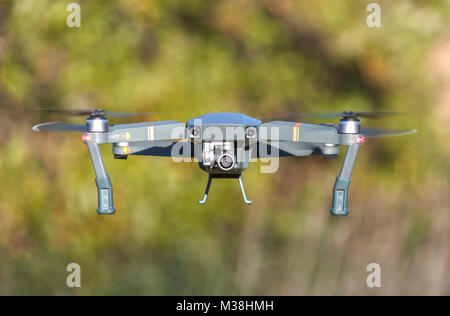 Close up of a drone uav  quadcopter in flight for recreational video and photography use Stock Photo