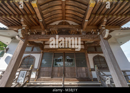 Kamakura, Japan - November 22, 2017 : Main Hall of Myoryuji Buddhist nichiren sect temple devoted to Jurojin (God of longevity) one of the Seven Gods  Stock Photo