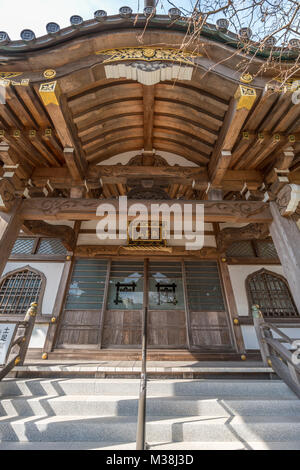 Kamakura, Japan - November 22, 2017 : Main Hall of Myoryuji Buddhist nichiren sect temple devoted to Jurojin (God of longevity) one of the Seven Gods  Stock Photo