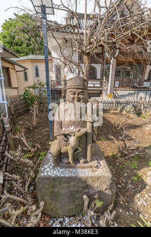 Kamakura, Japan - November 22, 2017 : Statue of Jurojin (God of longevity) one of the Seven Gods of Fortune 'Shichifukujin', Myoryuji Buddhist nichire Stock Photo