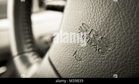 close up of Subaru SRS Airbag logo on Subaru steering wheel Stock Photo