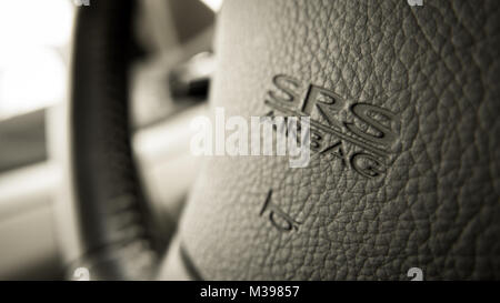 close up of Subaru SRS Airbag logo on Subaru steering wheel Stock Photo