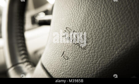 close up of Subaru SRS Airbag logo on Subaru steering wheel Stock Photo