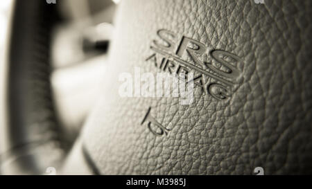 close up of Subaru SRS Airbag logo on Subaru steering wheel Stock Photo