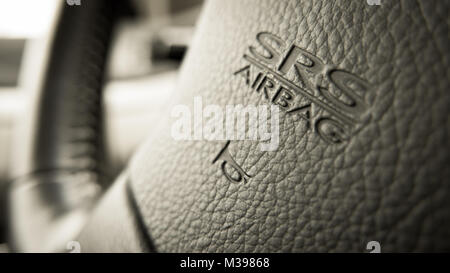 close up of Subaru SRS Airbag logo on Subaru steering wheel Stock Photo