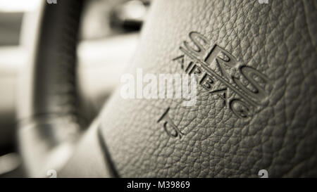 close up of Subaru SRS Airbag logo on Subaru steering wheel Stock Photo