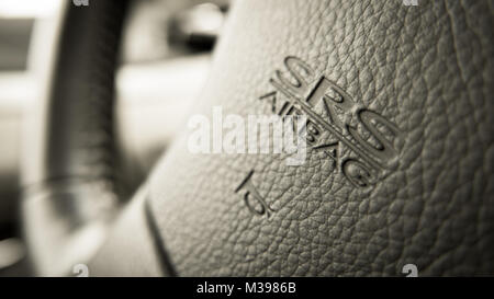 close up of Subaru SRS Airbag logo on Subaru steering wheel Stock Photo