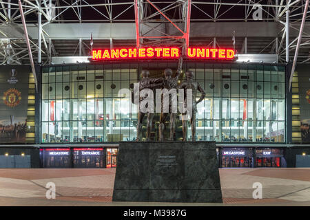 United Trinity Statue in front of Manchester United Football Club Stadium, Old Trafford, Manchester, Greater Manchester, England, UK Stock Photo