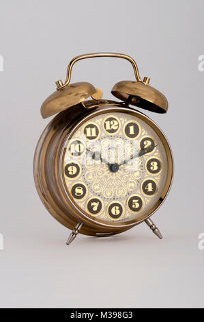 old golden alarm clock isolated on white background. Stock Photo