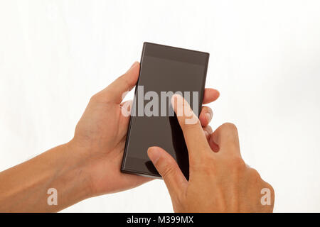 Men's hands on smartphone Stock Photo