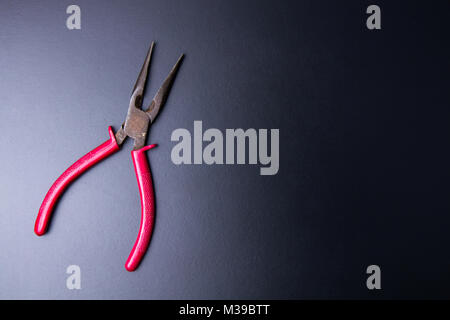 Wire cutters construction tools on a black background with light copy space.maintenance concept. Stock Photo