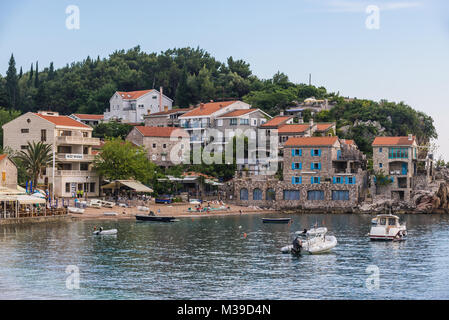 Houses over small bay in Przno resort village on the Adriatic Sea coast near Budva city Montenegro Stock Photo