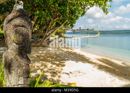 Idol made of a palm tree trunk on the beach of Aore Island, Republic of Vanuatu. Stock Photo