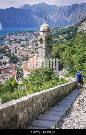 Bell tower of Church of Our Lady of Remedy on the slope of Saint John mountain above Old Town of Kotor town in Bay of Kotor, Montenegro Stock Photo