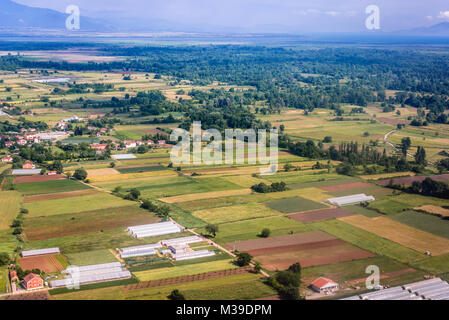 Aerial view from plane window on rural area of Zeta Plain around Podgorica Airport in Montenegro Stock Photo