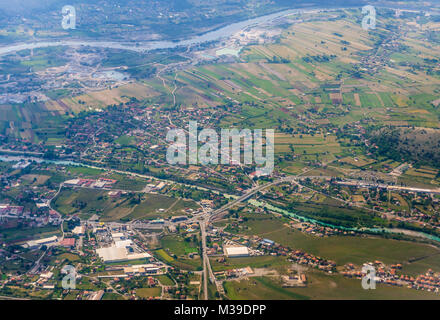 Aerial view from plane window on rural area around Podgorica Airport in Montenegro. Cem River and Moraca River on photo Stock Photo