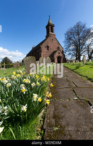 Village of Coddington, England. Picturesque view of the footpath leading to the front of St Mary’s Church, in the Cheshire village of Coddington. Stock Photo