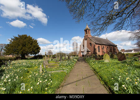 Village of Coddington, England. Picturesque view of the footpath leading to the front of St Mary’s Church, in the Cheshire village of Coddington. Stock Photo