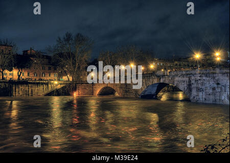 Extraordinary full of the Tiber river at night from the Tiber island to Garibaldi bridge, swallen river. Rome, Italy Stock Photo