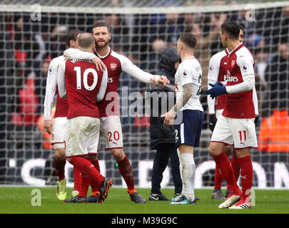 Arsenal's Shkodran Mustafi separates Jack Wilshere (left) and Tottenham Hotspur's Kieran Trippier (centre) after the Premier League match at Wembley Stadium, London. Stock Photo