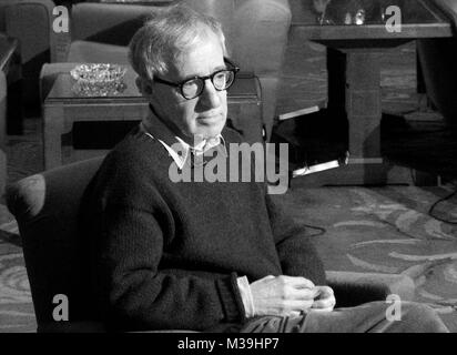 **** EXCLUSIVE COVERAGE  **** Woody Allen arriving in Oviedo, Spain for a Sold-Out Concert at the Auditorio Principe Felipe with his All Jazz Band. Mr. Allen was greeted by fans and the press at the Hotel De La Reconquista as well as in the Streets as he payed a revisit with his family and friends to the statue of himself that was sculpted and erected in Tribute. From time to time Vandals have been stealing the glasses off the statue. This visit showed they ony were successful with stealing half the pair. December 26, 2005 ( pictured: Taping a Video Thank You for MATCH POINT being Nominated fo Stock Photo