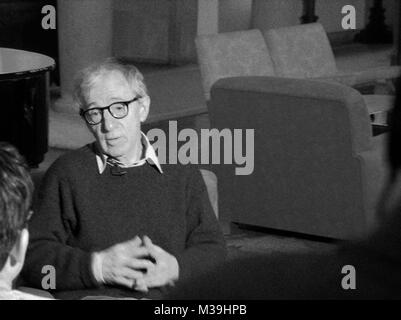 **** EXCLUSIVE COVERAGE  **** Woody Allen arriving in Oviedo, Spain for a Sold-Out Concert at the Auditorio Principe Felipe with his All Jazz Band. Mr. Allen was greeted by fans and the press at the Hotel De La Reconquista as well as in the Streets as he payed a revisit with his family and friends to the statue of himself that was sculpted and erected in Tribute. From time to time Vandals have been stealing the glasses off the statue. This visit showed they ony were successful with stealing half the pair. December 26, 2005 ( pictured: Taping a Video Thank You for MATCH POINT being Nominated fo Stock Photo