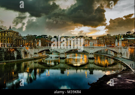 The dramatic sunsets in Rome,The  colors of the sunset are reflected on the placid waters of the Tevere.  Rome, Lazio region, Italy, Europe Stock Photo