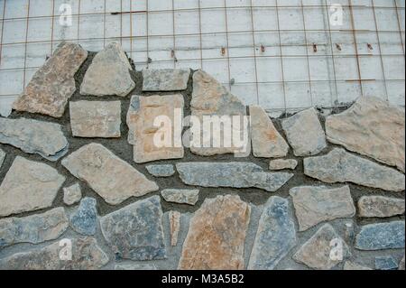 Coating with stones to make aesthetic wall Stock Photo