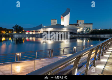The Imperial War Museum North at night, Salford Quays, Greater Manchester, England, UK Stock Photo