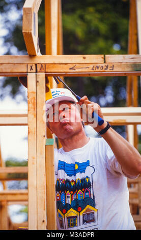 President Bill Clinton works to frame a house during a Habitat for Humanity house in Atlanta, Georgia. The build included volunteers such as Bill, Chelsea and Hillary Clinton, Al and Tipper Gore and Jimmy and Rosalynn Carter. Stock Photo