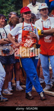 Hillary Clinton works to frame a house during a Habitat for Humanity house in Atlanta, Georgia. The build included volunteers such as Bill, Chelsea and Hillary Clinton, Al and Tipper Gore and Jimmy and Rosalynn Carter. Stock Photo