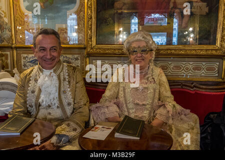 VENICE, ITALY - FEBRUARY 09: People wearing carnival costumes pose at Florian Caf on February 9, 2018 in Venice, Italy. Credit: Awakening Photo Agency/Alamy Live News Stock Photo
