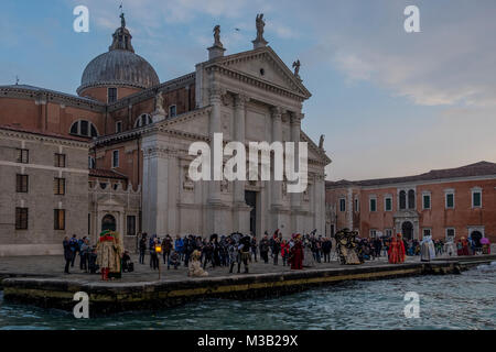 VENICE, ITALY - FEBRUARY 09: People wearing carnival costumes pose in front of San Marco during the 2018 Venice Carnival on February 9, 2018 in Venice, Italy. Credit: Awakening Photo Agency/Alamy Live News Stock Photo
