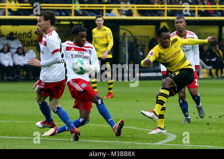 Dortmund, Germany. 10th Feb, 2018. Michy Batshuayi (2nd R) of Dortmund shoots during a German Bundesliga match between Borussia Dortmund and Hamburger SV, in Dortmund, Germany, Feb. 10, 2018. Dortmund won 2-0. Credit: Joachim Bywaletz/Xinhua/Alamy Live News Stock Photo