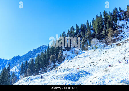Amazing landscape with mountains sea blue sky sun and beautiful colorful red clouds at sunset Sunset in mountains. Panoramic. Nature background. Stock Photo