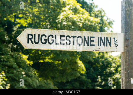 Old signpost giving directions to  the Rugllestone Inn, Widecombe-in-the-Moor, Dartmoor, Devon, England Stock Photo