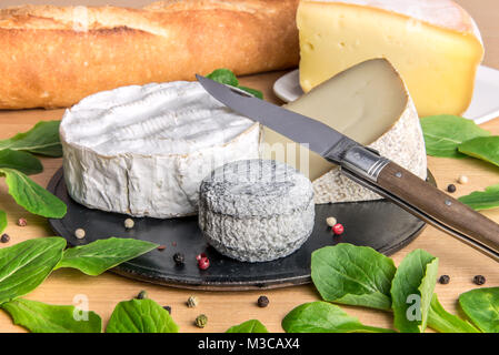 Platter of assorted french cheese with baguette Stock Photo