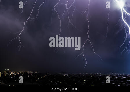 Lightning over City landscape Stock Photo